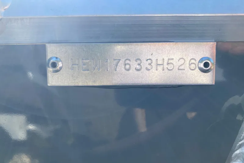 Slide: The Image of View from inside a 2026 Hewescraft 200 ProV ET HT boat, parked outdoors. - 8