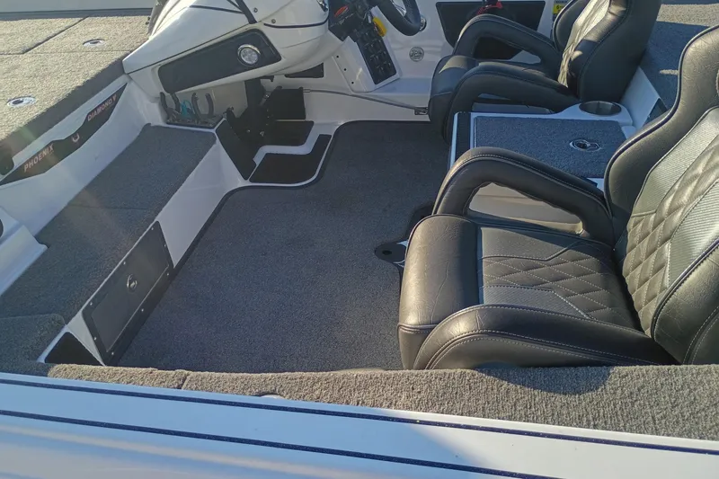Slide: The Image of Interior of 2026 Phoenix 921 Elite X II boat with leather seating and modern dashboard. - 6
