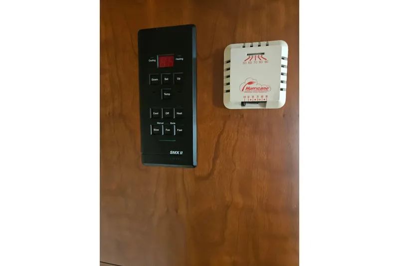 Slide: The Image of Interior of 2000 Cruisers Yachts 4450 Express Motoryacht with wooden cabinetry and cushions. - 38