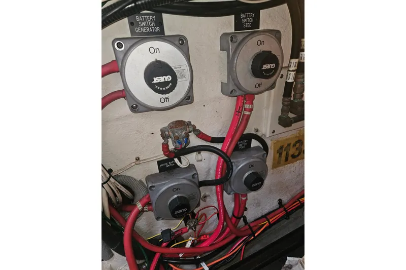 Slide: The Image of Battery switches and wiring in a 2000 Cruisers Yachts 4450 Express Motoryacht. - 60