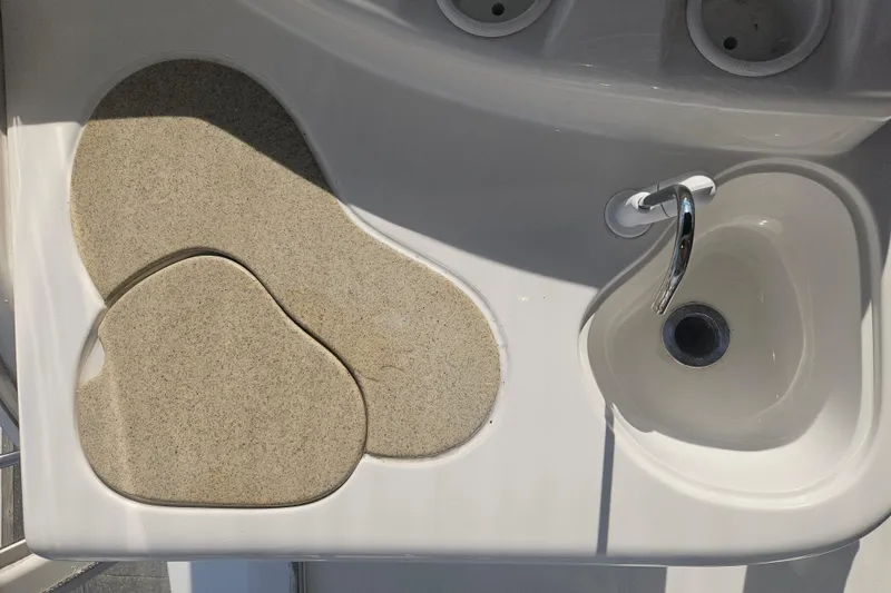 Slide: The Image of Interior view of 2000 Cruisers Yachts 4450 Express Motoryacht, featuring sleek design and marina backdrop. - 11