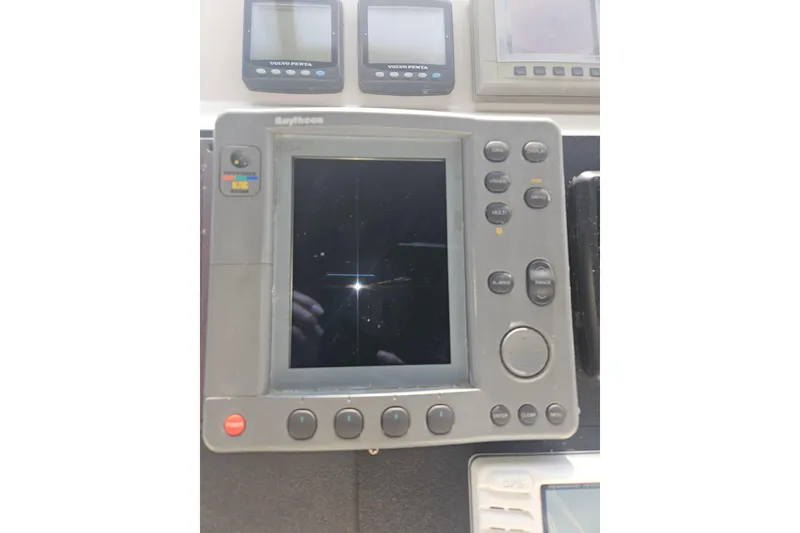 Slide: The Image of Open refrigerator on 2000 Cruisers Yachts 4450 Express Motoryacht, showing interior shelves. - 15