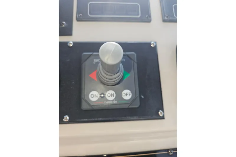 Slide: The Image of Control panel of a 2000 Cruisers Yachts 4450 Express Motoryacht with navigation equipment. - 18
