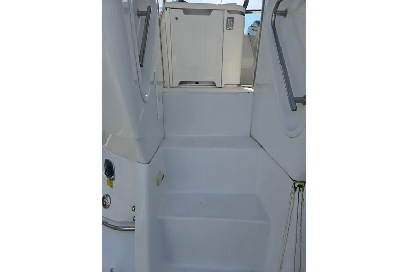 Slide: The Image of 2000 Cruisers Yachts 4450 Express Motoryacht, rear view with steps and dock connections. - 2