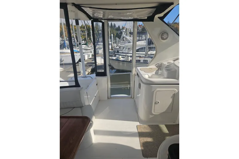 Slide: The Image of 2000 Cruisers Yachts 4450 Express Motoryacht, rear view with steps and railing. - 3