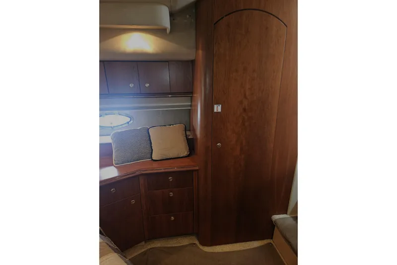 Slide: The Image of Luxurious cabin interior of 2000 Cruisers Yachts 4450 Express Motoryacht with wood cabinetry. - 35