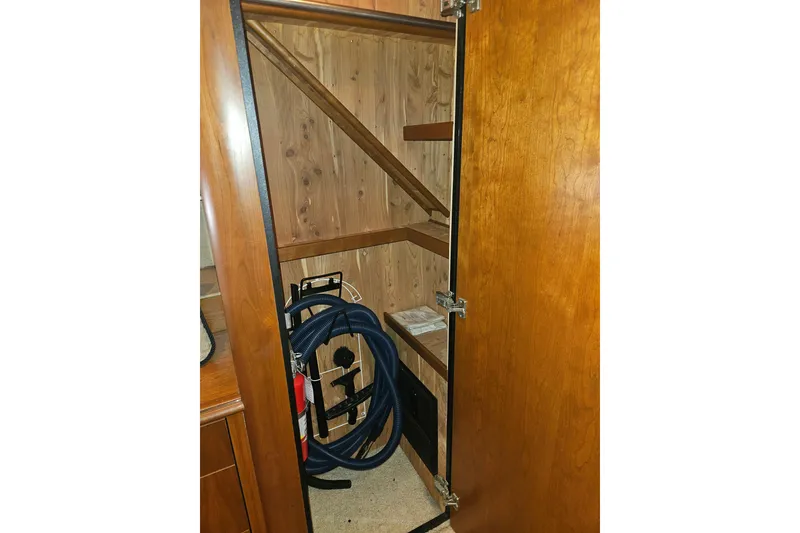 Slide: The Image of Luxurious 2000 Cruisers Yachts 4450 Express Motoryacht interior with wood doors and vanity. - 36