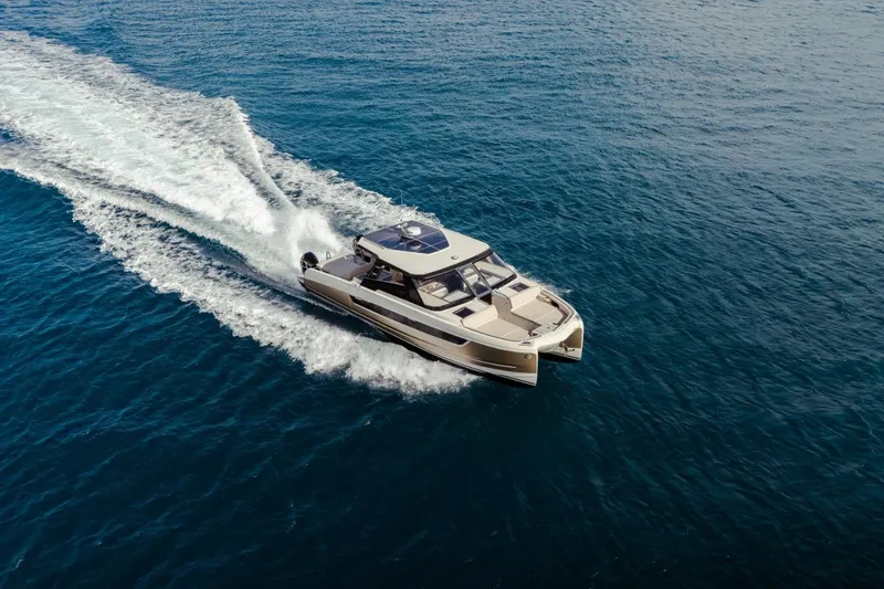 Slide: The Image of 2025 Harris-Kayot 41 boat cruising on open blue water. - 7