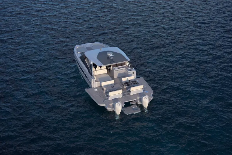Slide: The Image of 2025 Harris-Kayot 41 boat on open water, showcasing modern design and spacious deck. - 8
