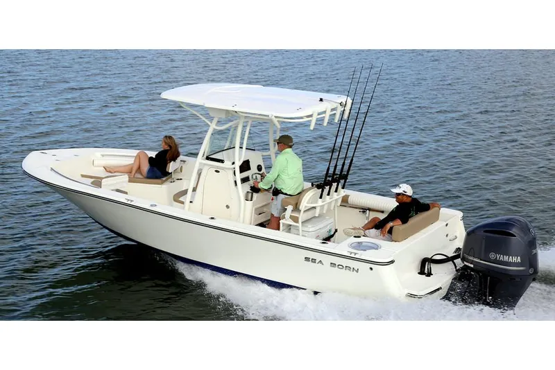 Slide: The Image of 2026 Sea Born LX24 Center Console boat interior with steering wheel and rod holders. - 4
