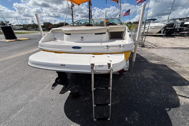Slide: The Image of 2004 Chaparral 210 SSi boat rear view with swim platform and ladder. - 13