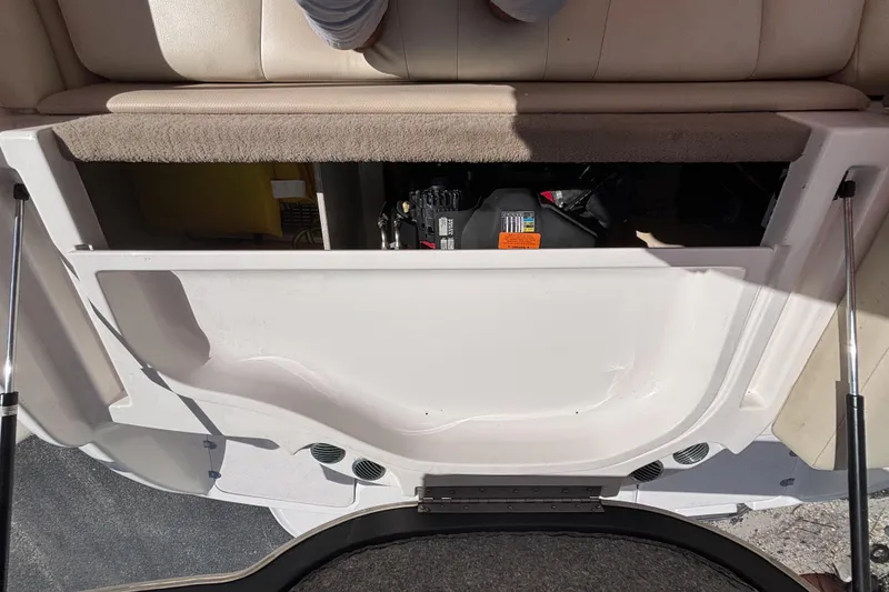 Slide: The Image of Open engine compartment of a 2004 Chaparral 210 SSi boat, showing interior details. - 30