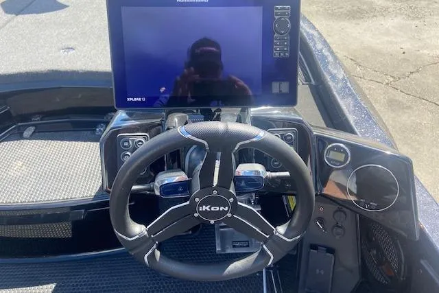 Slide: The Image of Steering wheel and dashboard of 2026 iKon VLX 20 boat with digital display. - 4