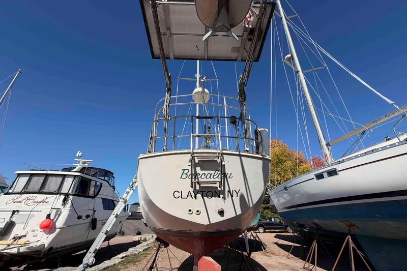 Slide: The Image of 1983 Hinterhoeller Niagara 35 sailboat in dry dock, Clayton, NY, with clear blue sky. - 4