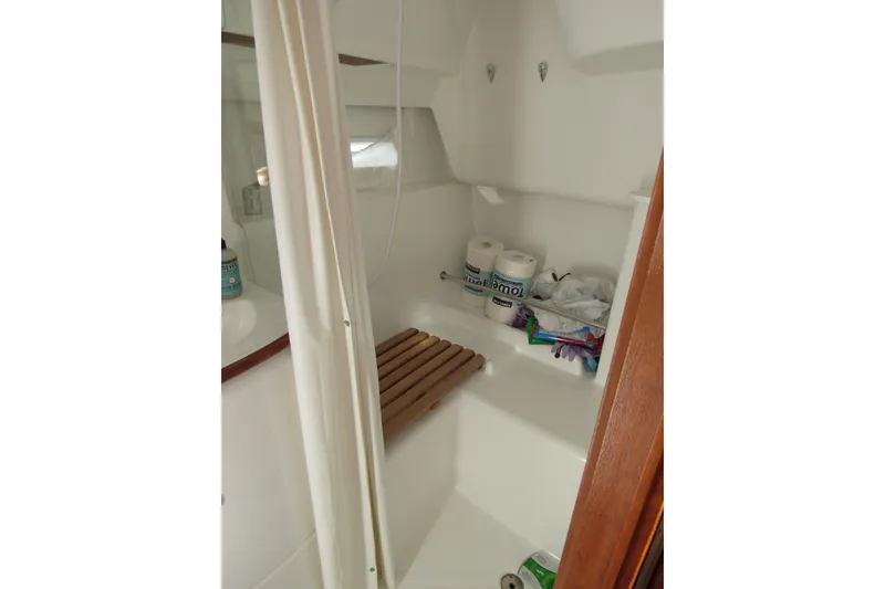 Slide: The Image of Bathroom area of 2005 Beneteau Oceanis 373 sailboat with toiletries and supplies. - 13