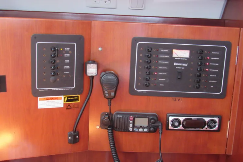 Slide: The Image of Control panel of a 2005 Beneteau Oceanis 373 sailboat with communication equipment. - 16