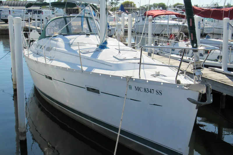 Slide: The Image of 2005 Beneteau Oceanis 373 sailboat docked at marina, front view. - 2