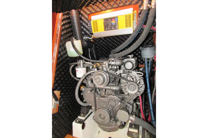 Slide: The Image of Engine compartment of a 2005 Beneteau Oceanis 373 sailboat, showcasing mechanical components. - 21