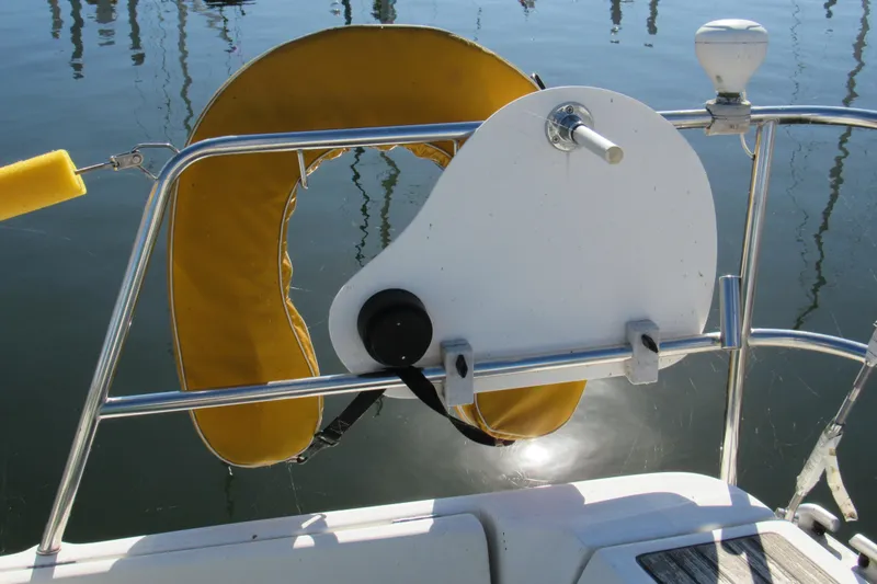 Slide: The Image of Yellow life preserver on 2005 Beneteau Oceanis 373 sailboat, secured to railing. - 5