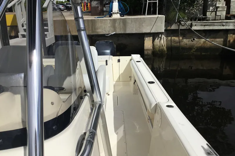 Slide: The Image of 2007 Pursuit C 280 Center Console boat docked by a concrete pier. - 26