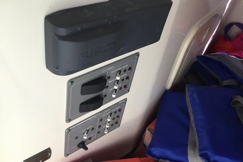 Slide: The Image of 2007 Pursuit C 280 Center Console boat control panel with switches and storage bags. - 30