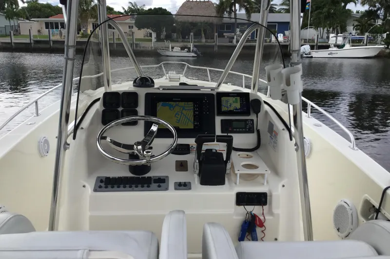 Slide: The Image of 2007 Pursuit C 280 Center Console boat interior with navigation equipment and steering wheel. - 31