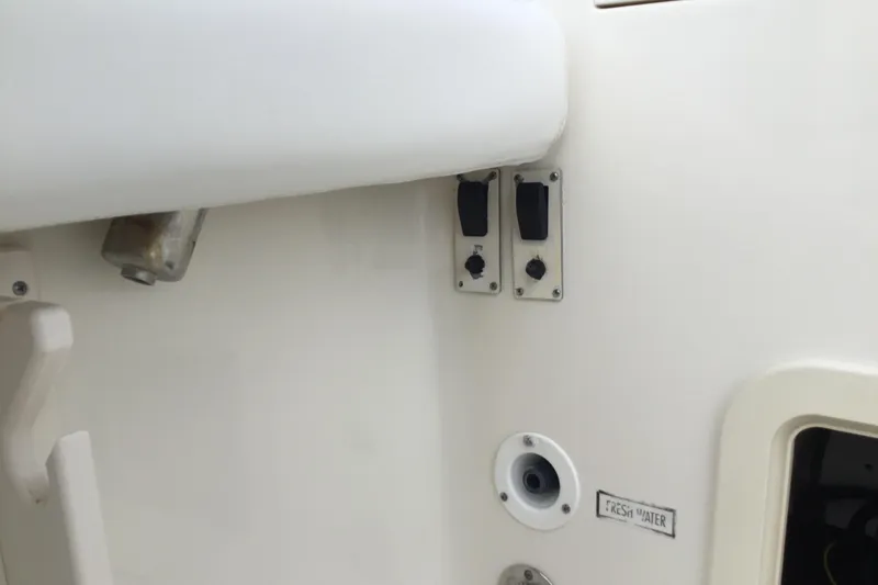 Slide: The Image of 2007 Pursuit C 280 Center Console boat controls and fresh water access. - 41