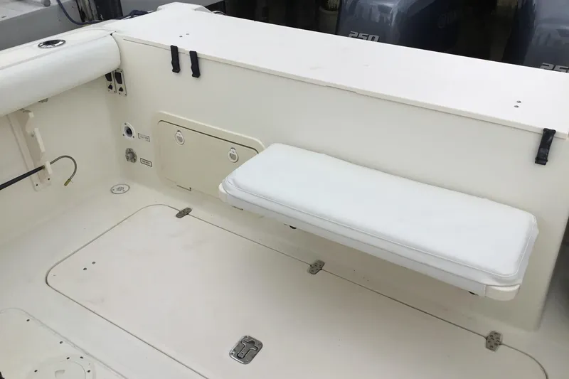 Slide: The Image of 2007 Pursuit C 280 Center Console boat interior with white cushioned seating. - 44