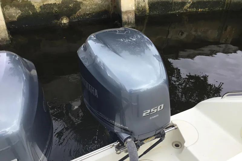 Slide: The Image of Twin Yamaha 250 engines on a 2007 Pursuit C 280 Center Console boat. - 46