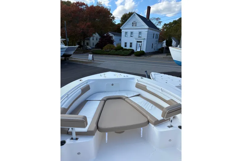 Slide: The Image of Manufacturer Provided Image: 2025 Sea Born LX26 Center Console boat cruising on water at sunset. - 8