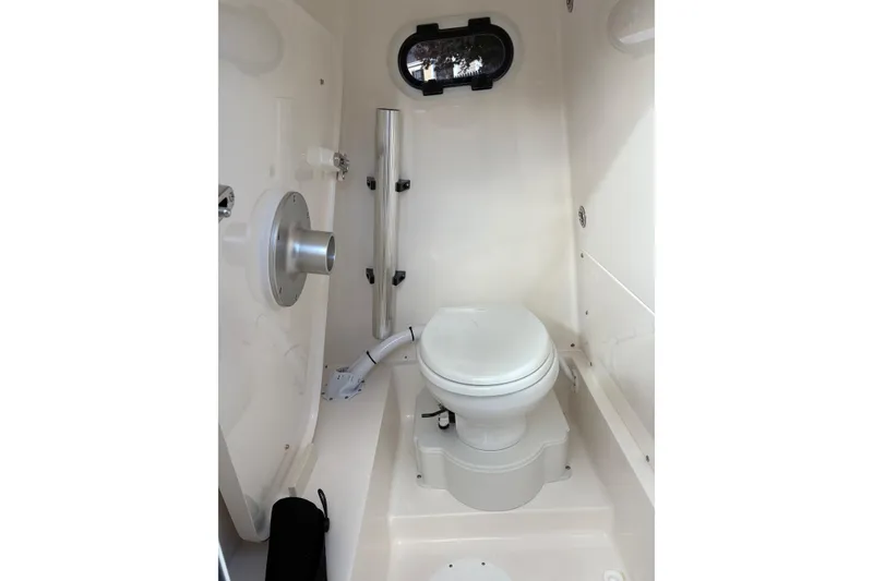 Slide: The Image of Manufacturer Provided Image: 2025 Sea Born LX26 Center Console boat interior with white seating and table. - 9