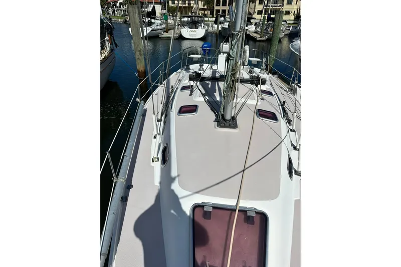 Slide: The Image of 2008 Catalina 320 sailboat deck view in marina setting. - 11
