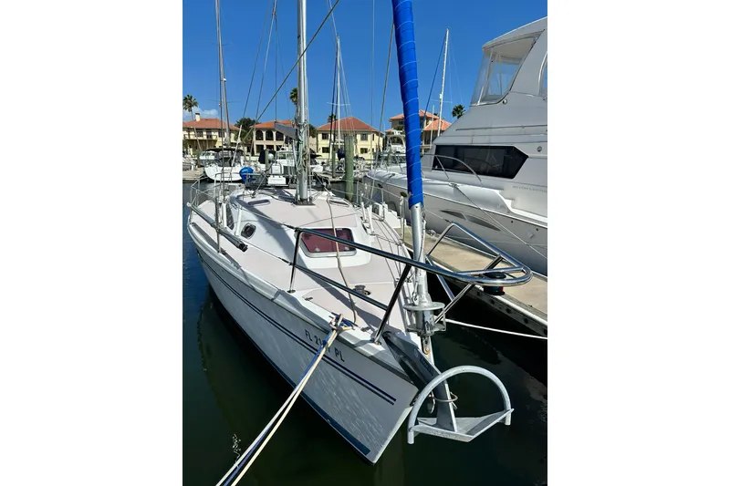 Slide: The Image of 2008 Catalina 320 sailboat docked at marina, sunny day, clear blue sky. - 19