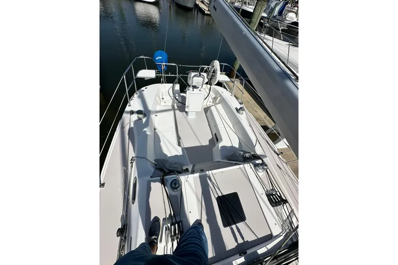 Slide: The Image of 2008 Catalina 320 sailboat deck view at marina, showcasing cockpit and rigging. - 28