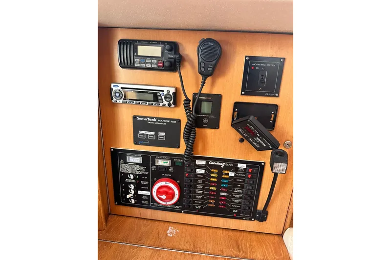 Slide: The Image of Control panel of a 2008 Catalina 320 sailboat with communication and monitoring equipment. - 34
