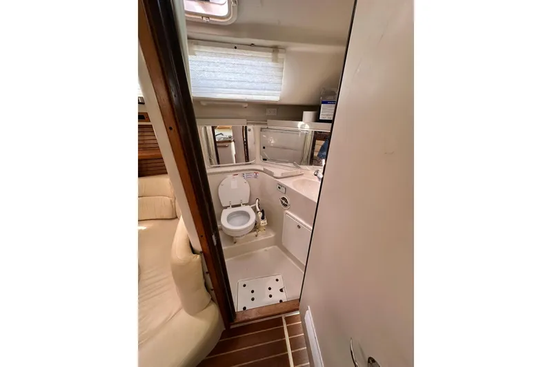 Slide: The Image of 2008 Catalina 320 yacht bathroom interior with toilet and sink. - 40