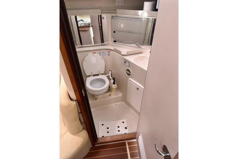 Slide: The Image of Catalina 320 yacht bathroom interior, 2008 model, featuring compact toilet and sink. - 41