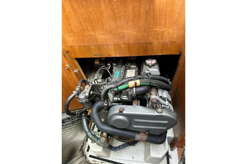 Slide: The Image of Catalina 320 2008 engine compartment with visible mechanical components. - 56
