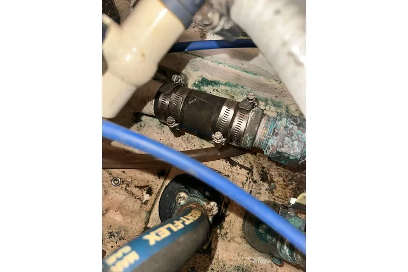 Slide: The Image of Close-up of Catalina 320 boat plumbing system with hoses and clamps, 2008 model. - 58