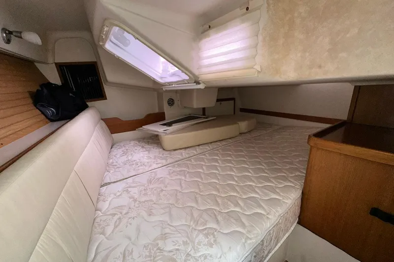 Slide: The Image of Cozy interior cabin of 2008 Catalina 320 sailboat with comfortable bedding and natural light. - 59