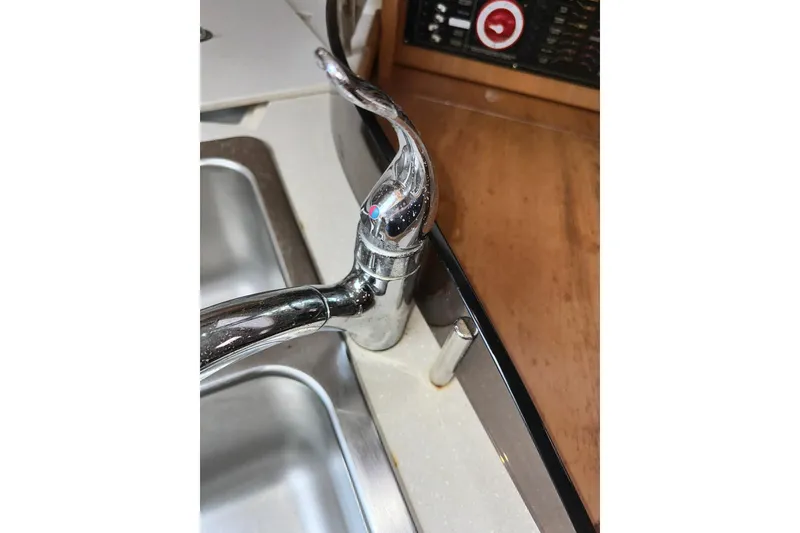 Slide: The Image of Chrome faucet in Catalina 320 yacht kitchen, 2008 model, with dual sink and control panel. - 60