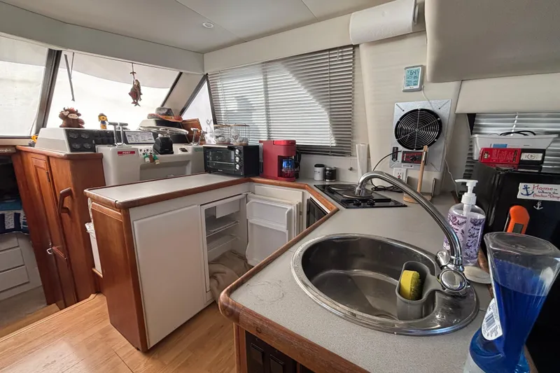 Slide: The Image of Interior of a 1993 Carver 350 Voyager yacht with modern amenities and cozy decor. - 10