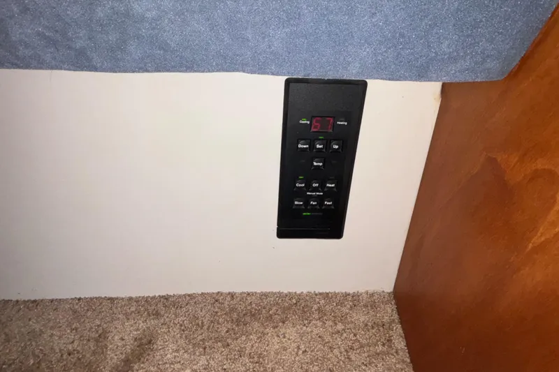 Slide: The Image of Interior of 1993 Carver 350 Voyager yacht with kitchen and seating area. - 19