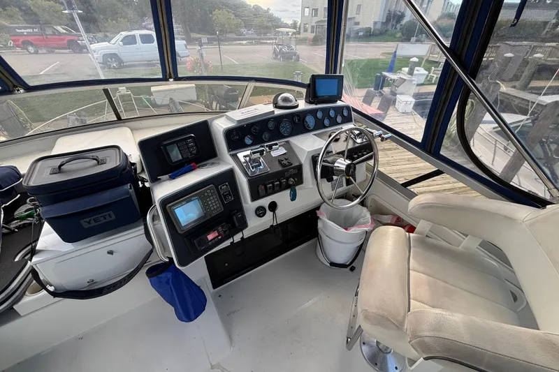 Slide: The Image of 1993 Carver 350 Voyager helm with navigation equipment and captain's chair. - 30