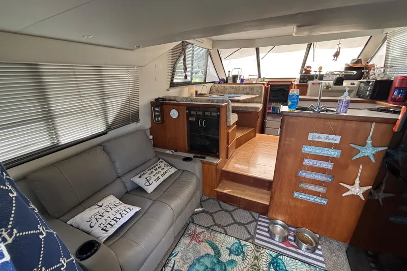 Slide: The Image of 1993 Carver 350 Voyager boat deck with seating and water view. - 7