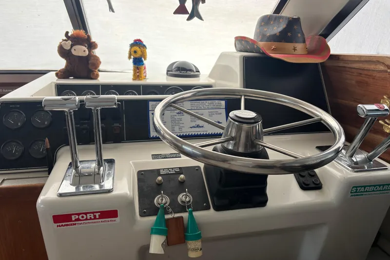 Slide: The Image of Interior of 1993 Carver 350 Voyager yacht with cozy dining area and wooden cabinetry. - 12