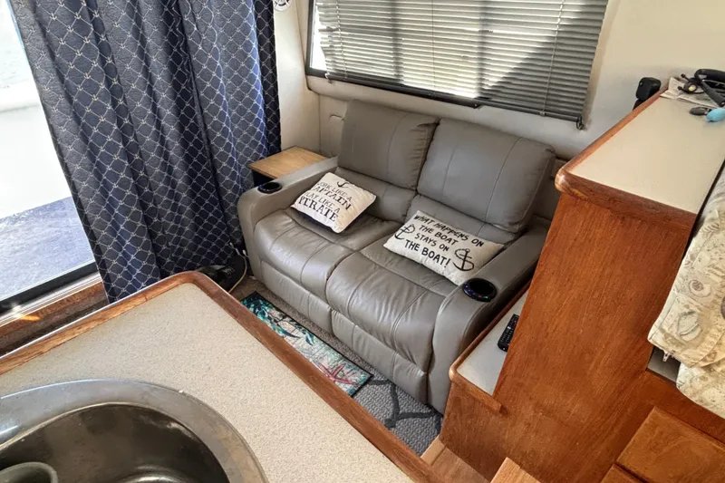 Slide: The Image of Interior of 1993 Carver 350 Voyager yacht kitchen with sink, stove, and appliances. - 13