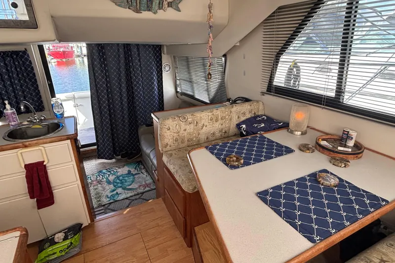 Slide: The Image of 1993 Carver 350 Voyager helm with steering wheel, controls, and decorative items. - 15