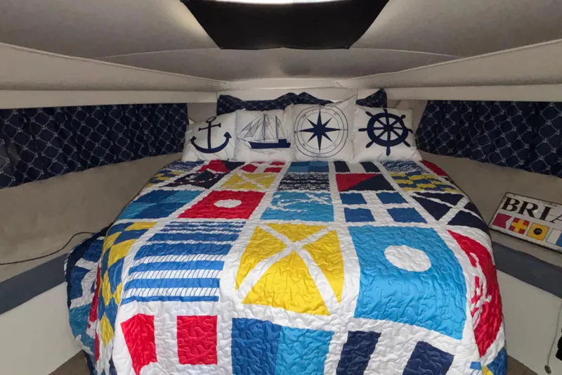 Slide: The Image of Interior of 1993 Carver 350 Voyager yacht with dining area and kitchenette. - 18