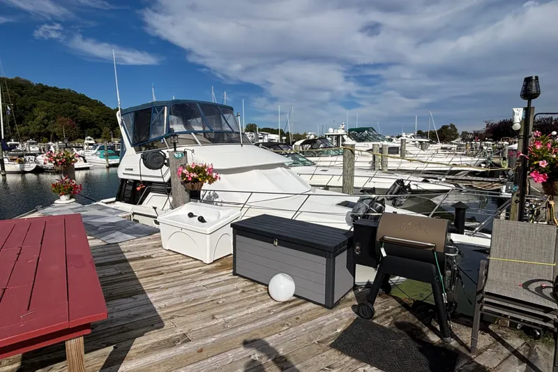 Slide: The Image of Interior of a 1993 Carver 350 Voyager yacht with cozy seating and nautical decor. - 2
